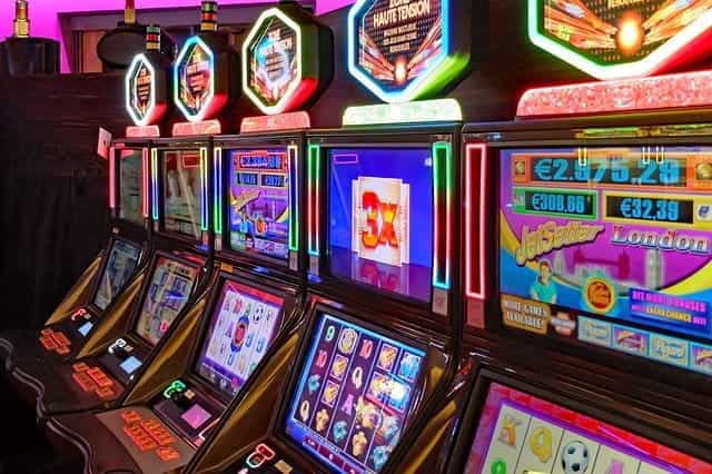 A row of slot machines in a casino.
