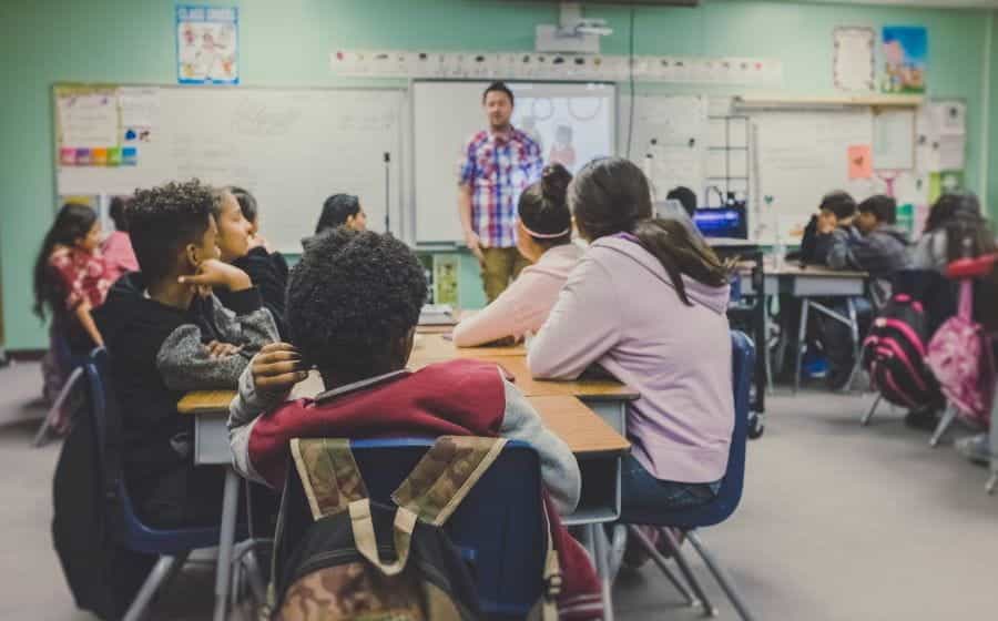 Children in a classroom with a teacher.