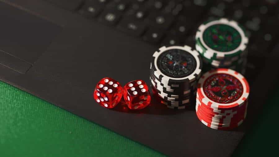 Chips and dice on a laptop.