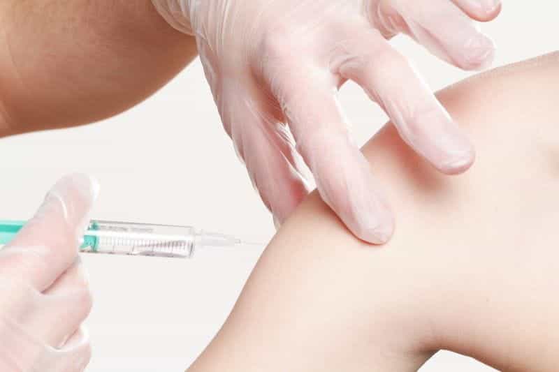 A patient receives a vaccine.