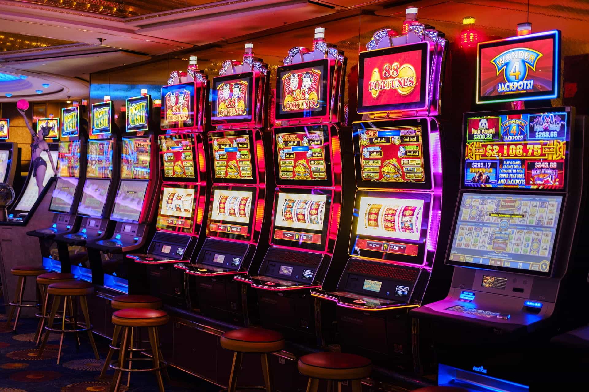 A row of eight slot machines in a casino