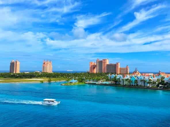 The Atlantis Paradise Island casino-resort against a blue sky on a sunny day in the Bahamas.