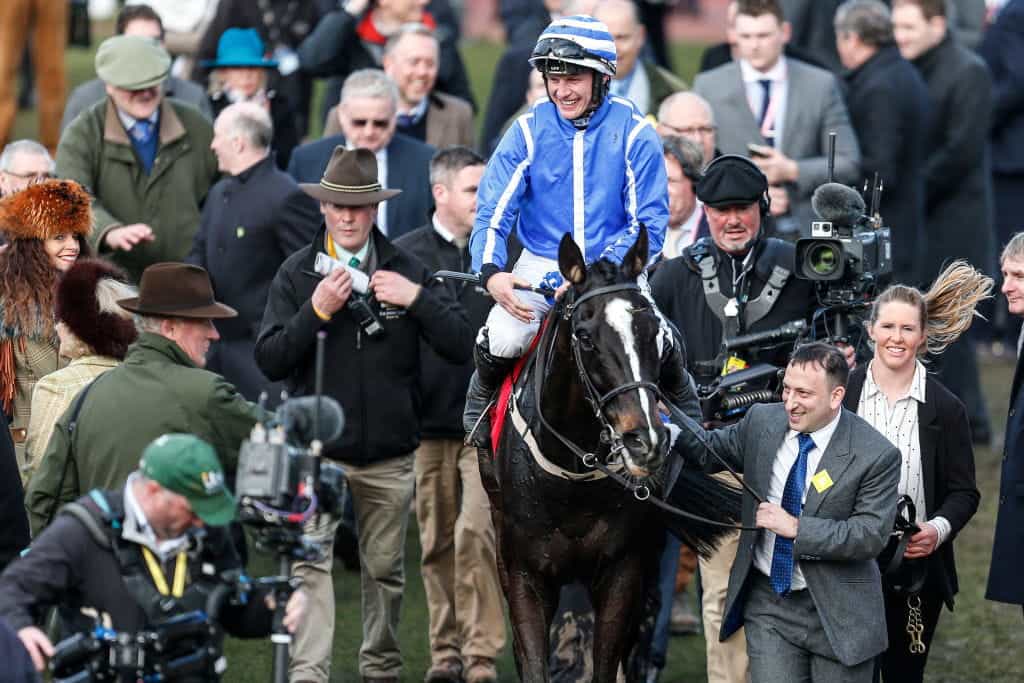 Tony Bloom leading in a winner at the 2018 Cheltenham Festival.