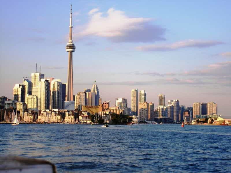 The busy skyline of downtown Toronto, Ontario from the water of Lake Ontario.