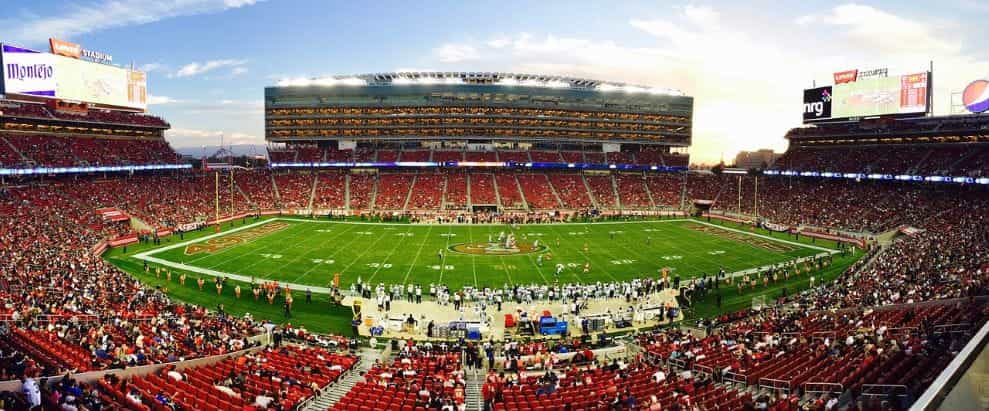 A full-size American football stadium mid-game.