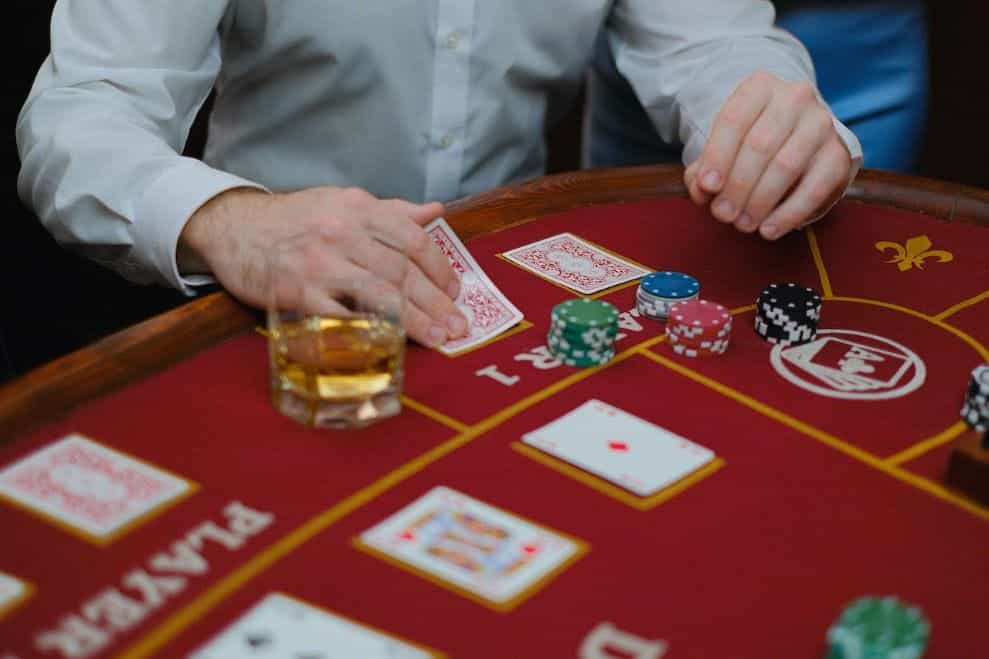 A person playing cards in a casino.