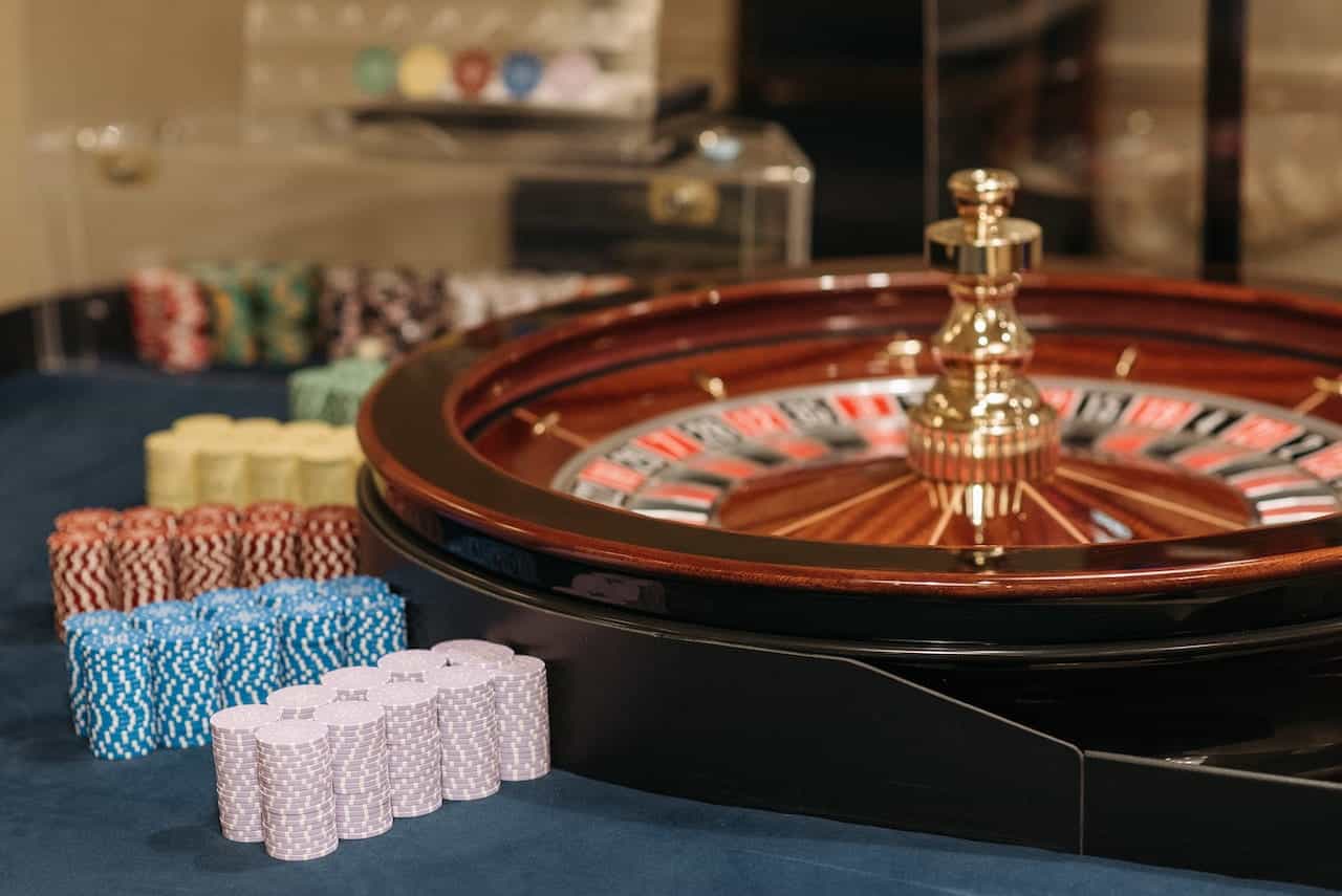 A roulette wheel and poker chips in a casino