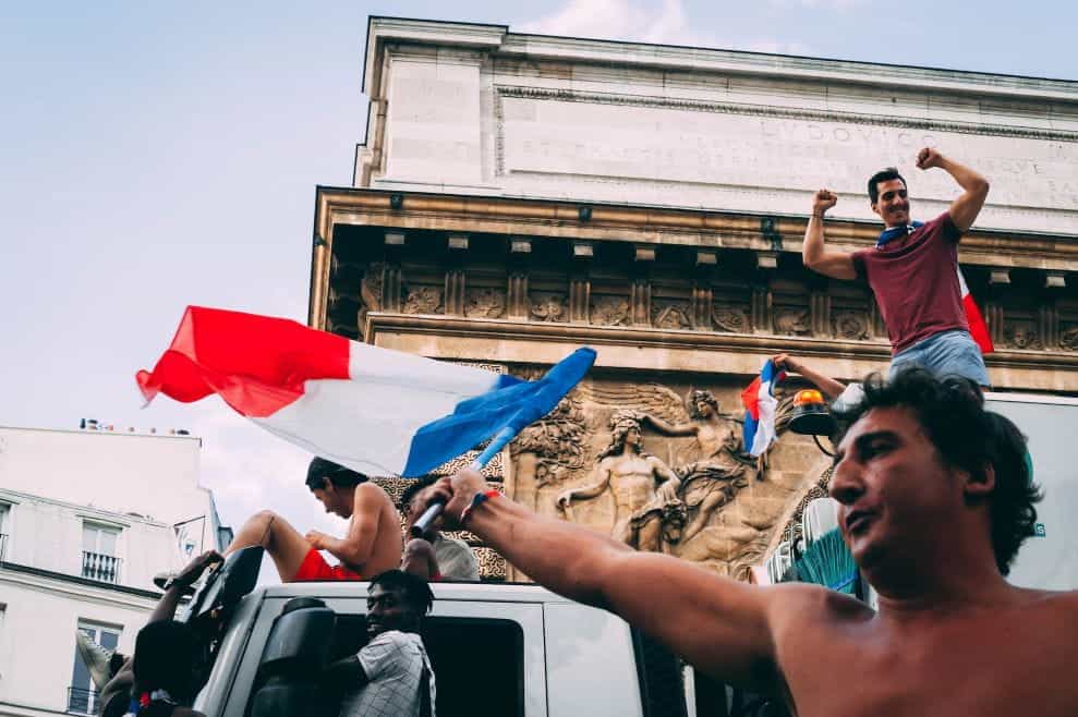 French sports supporters celebrating in the streets.
