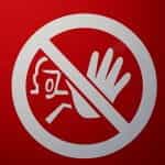 A figure extending their hand out to stop something overlaid with a large circle with a cross going diagonally through it on a bright red background.
