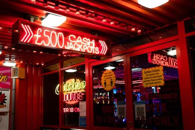 A Casino Lounge from outside, lit with various colorful lights.