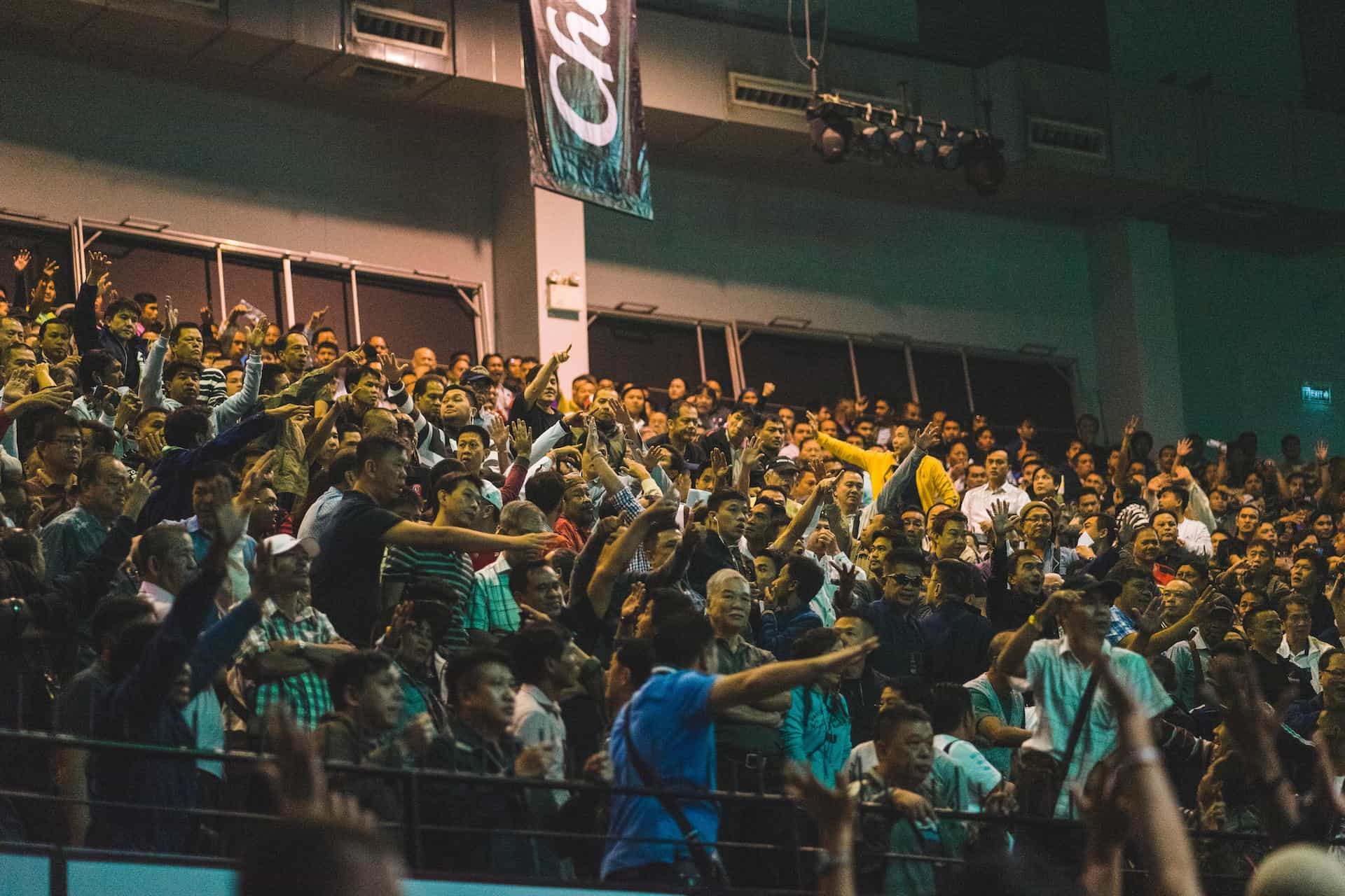 The crowd in the stands during a professional sporting event in an outdoor stadium.