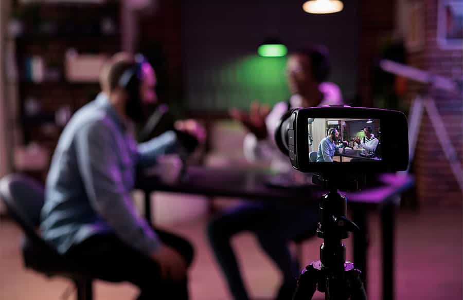 Two people being filmed with a camera