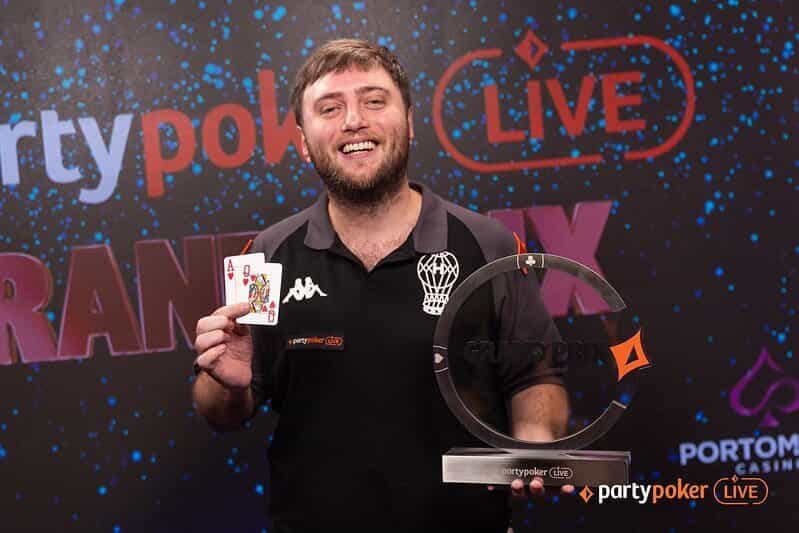 Argentinian poker player Jacques Blit shows off his Millions Festival Malta, Grand Prix trophy.