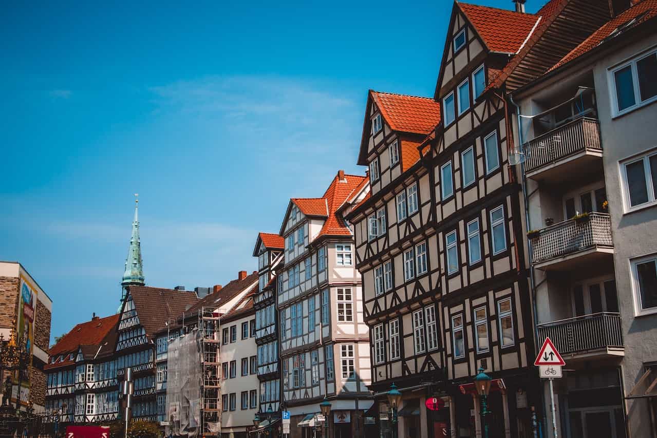 A number of buildings under a clear blue sky.