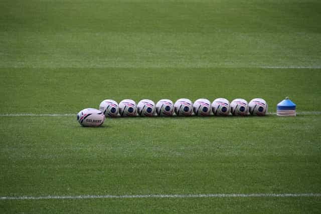 Rugby balls on the field.