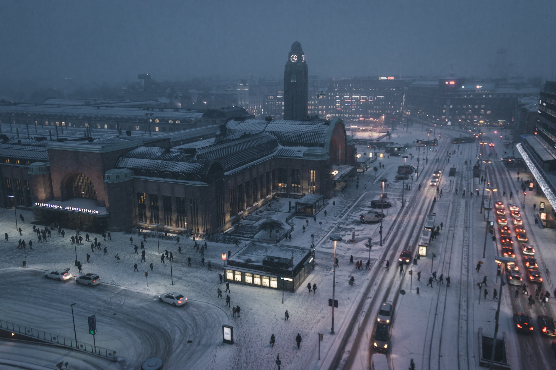 A city square at night covered in snow.